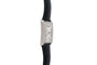 Side view of the Piaget Black Tie Emperador Coussin Automatique, a rectangular silver watch with a black leather strap, shown on a white background.