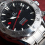 Close-up of an OMEGA Seamaster 300 Professional Apnea Chronograph dial and part of its stainless steel bracelet.