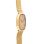 Side view of the Patek Philippe Ellipse TV Case, a gold wristwatch featuring a mesh band and a rounded rectangular face with Roman numerals.
