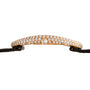 Side view of the Cartier Baignoire Allongee gold case encrusted with diamonds, paired with a black leather strap.