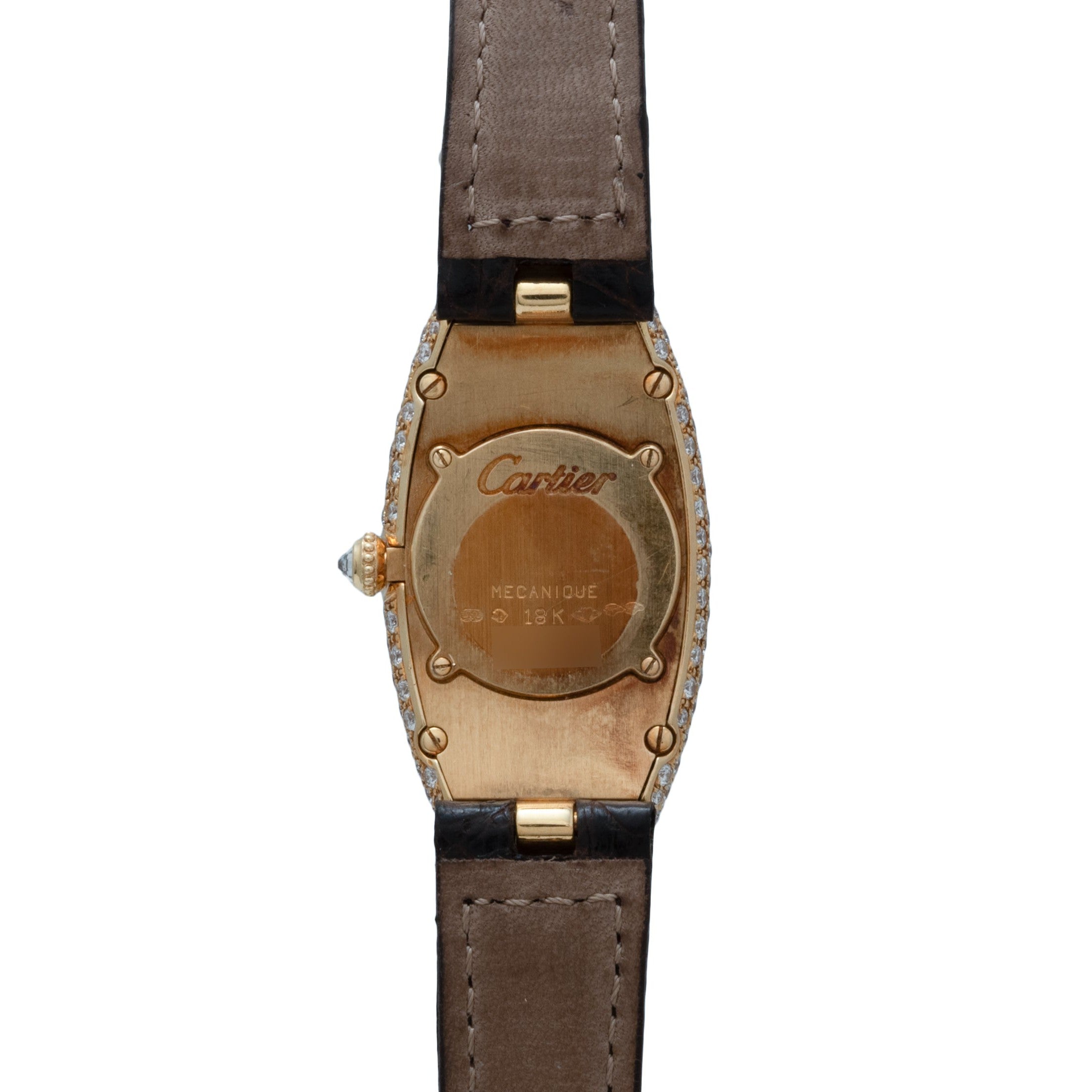 Back view of the Cartier Baignoire Allongee wristwatch in gold with a brown leather strap and diamond-set case edges.