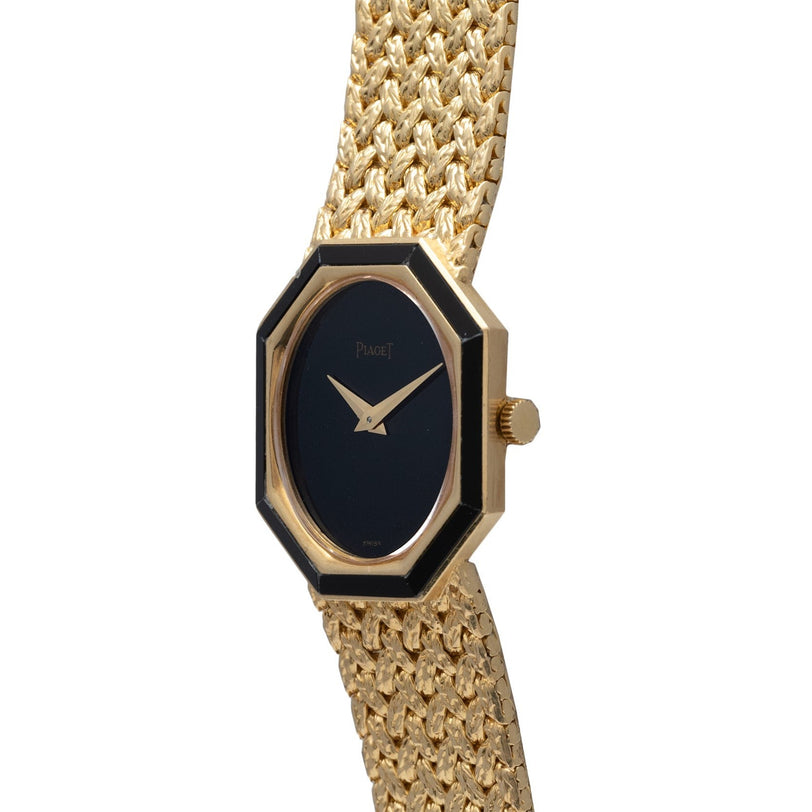 Piaget Onyx Dial gold wristwatch featuring a black octagonal face and a woven gold band, shown from a side angle.