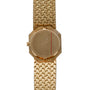The Piaget Onyx Dial is a gold wristwatch featuring a textured band and a minimalist, unmarked face.