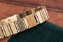 Close-up of the Piaget Polo Square gold and silver metal watch bracelet clasp featuring an engraved P.