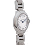 The Cartier Ballon Bleu wristwatch features Roman numerals and blue hands on a metal band, shown from an angle.