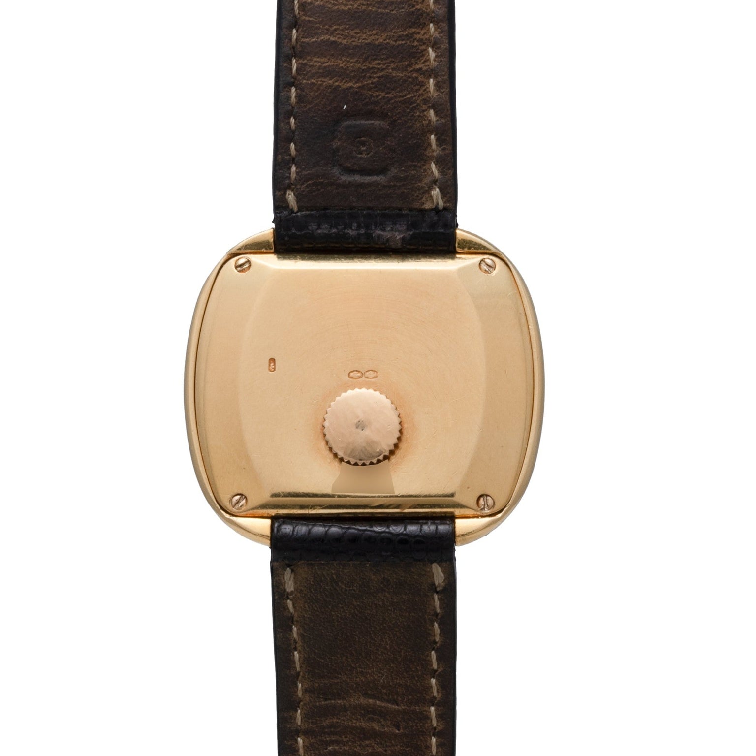 The Emperador Mini Warhol by Piaget features a gold case back with a leather strap, adorned with an engraved crown and infinity symbol.