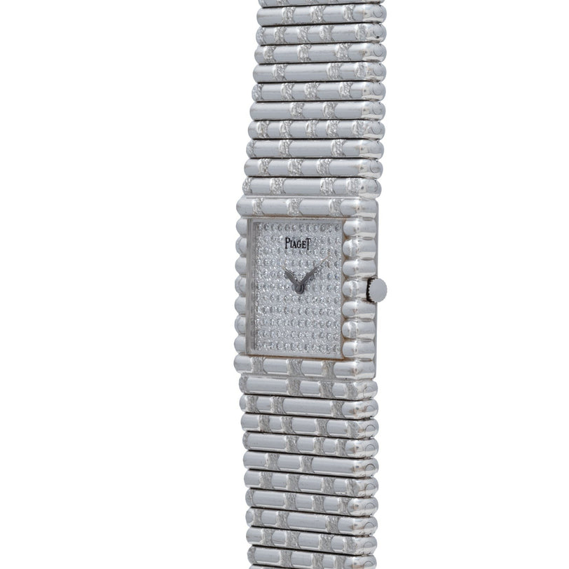 The Piaget Emperador Diamond is a luxury silver wristwatch featuring a rectangular face and a textured metal band.