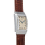 The Vacheron Constantin Rectangular Steel Dress Watch features a brown leather strap and black numerals on a cream dial.