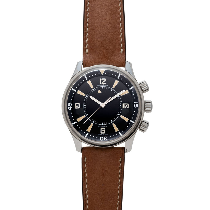 The Jaeger-LeCoultre Tribute to Polaris is a wristwatch with a brown leather strap, black dial, white markers, and three side crowns.