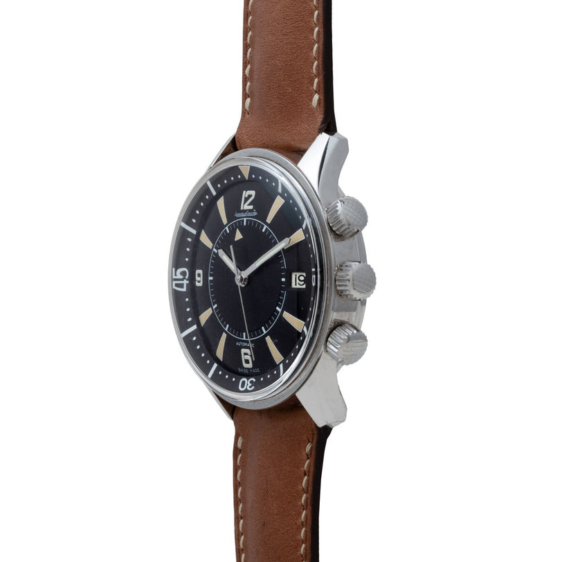 The Jaeger-LeCoultre Tribute to Polaris is a classic wristwatch featuring a black dial, brown leather strap, and three crowns on the side.