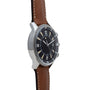 The Jaeger-LeCoultre Tribute to Polaris features a black dial, brown leather strap, silver case, and bold white hour markers.