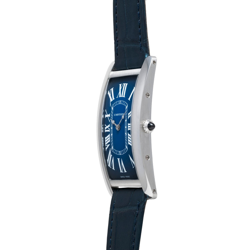 Side view of a Cartier Tank Cintrée wristwatch featuring a blue face with Roman numerals and a dark leather strap.