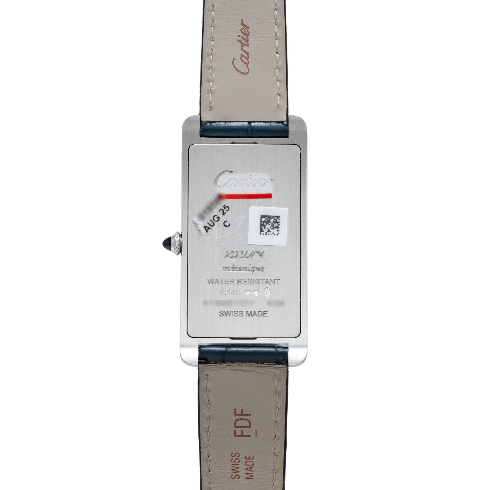 Back of a Cartier Tank Cintrée wristwatch with engravings, a QR code, and visible leather straps.
