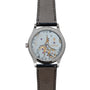 Back view of the Patek Philippe Calatrava wristwatch displays its intricate mechanical movement and elegant leather strap.