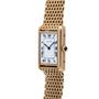 The Cartier Tank Louis watch features a rectangular face with Roman numerals and a gold mesh bracelet, shown on a white background.