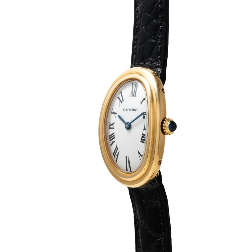 Cartier Baignoire wristwatch featuring a gold case, black leather strap, and Roman numerals on a white oval dial.