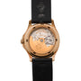 Back view of the Patek Philippe Aquanaut luxury watch featuring a visible mechanical movement and a black rubber strap.