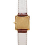 Back view of the Piaget Bamboo Dress Watch featuring a square gold case, brown leather straps, and cream-colored lining.
