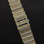The Piaget Polo Pave wristwatch features rows of sparkling diamonds in gold and silver on a black textured background.