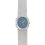 The Piaget Opal White Gold Dress Watch features a textured band, blue opal face, and diamond accents around the bezel.