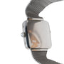Close-up side view of the Cartier Santos Platinum wristwatch featuring a silver mesh metal band and a small winding crown.