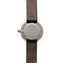 Back view of the Cartier Vendome Diamond wristwatch, featuring a round silver case with brown leather straps and an engraving that reads Paris.