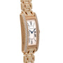 The Cartier Tank Americaine Diamond is a gold watch with diamond accents and a rectangular face featuring Roman numeral markers.