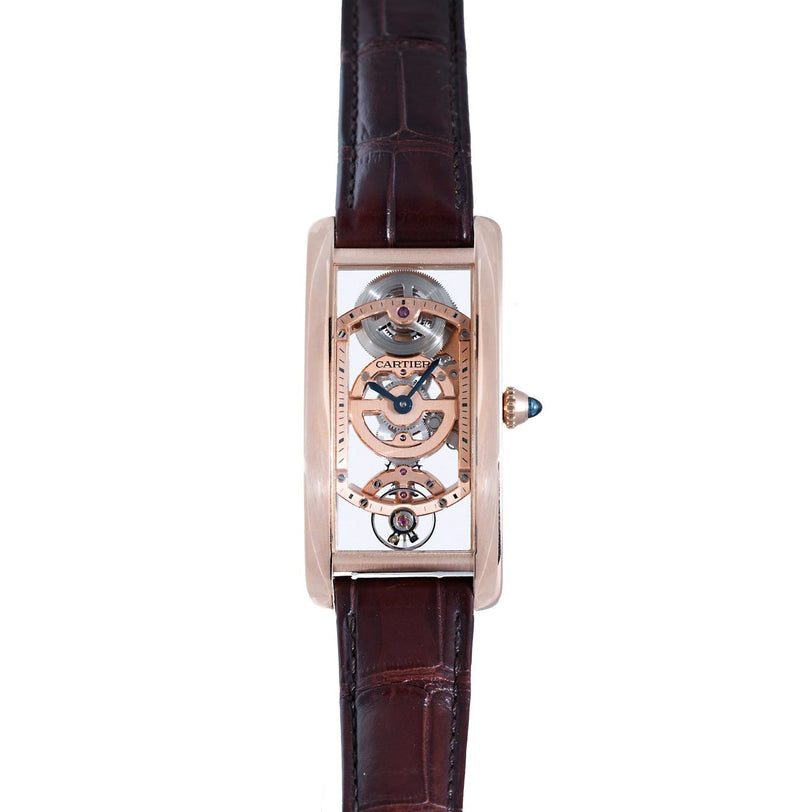 The Cartier Tank Cintreé Skeleton is a luxury watch featuring a skeleton dial and a brown leather strap that reveals its intricate inner mechanisms.