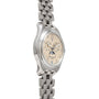 The Patek Philippe Annual Calendar wristwatch features a silver case, beige dial with Roman numerals, and a linked metal band, displayed at an angle.