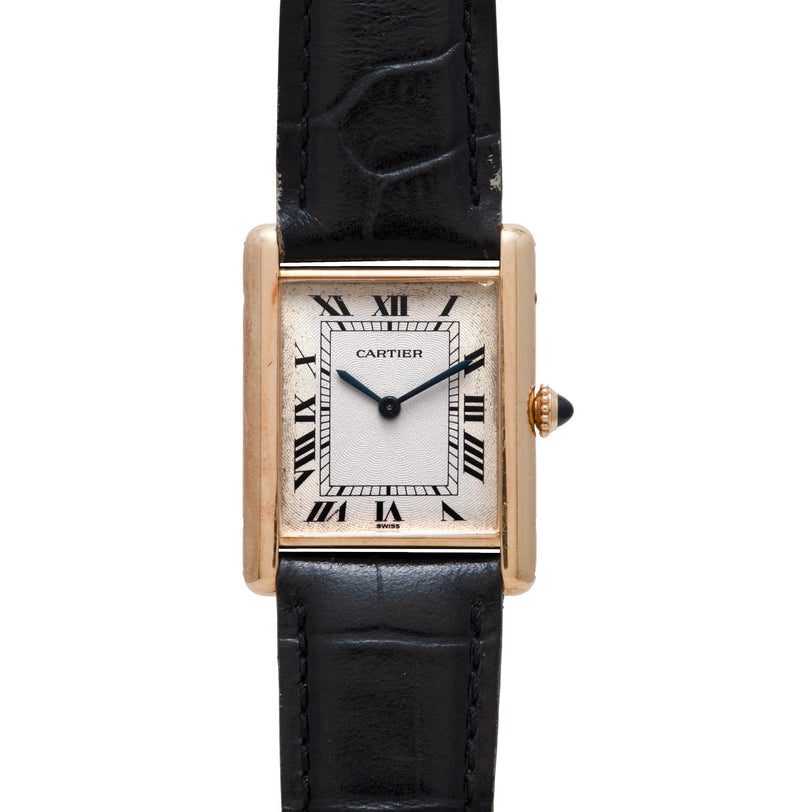 The Cartier Tank Louis Mechaniqúe features a rectangular face, black Roman numerals, and a black leather strap.