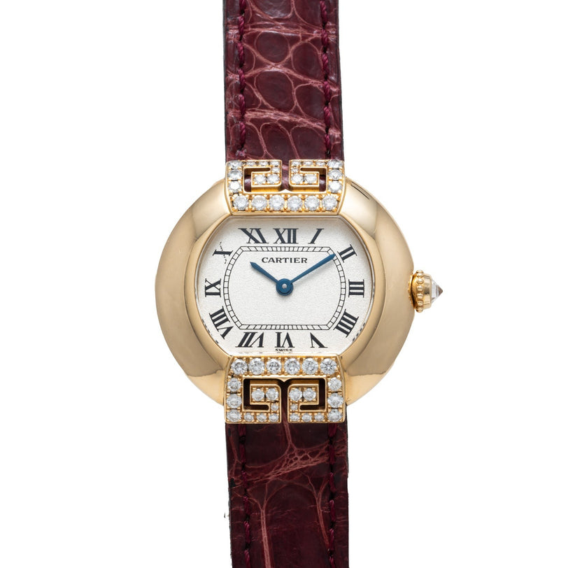 Cartier Ellipse watch featuring Roman numerals, diamond accents, and a burgundy leather strap.