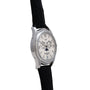 Side view of the Patek Philippe Annual Calendar Moonphase, featuring a silver case, white dial, black leather strap, and moon phase detail.