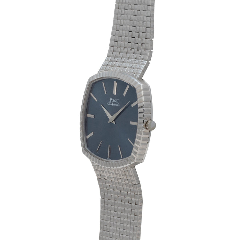 Piaget Sqound White Gold Dress Watch featuring a dark blue face, silver hour markers, and a textured metal band.