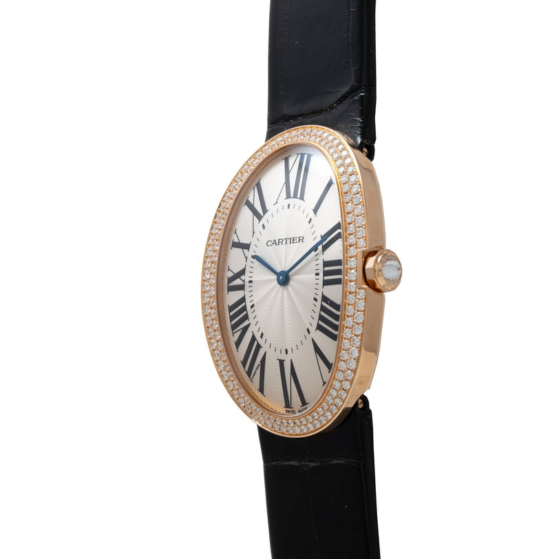 Cartier Baignoire Jumbo gold wristwatch with diamond bezel, Roman numerals, and black leather strap, shown from an angle.