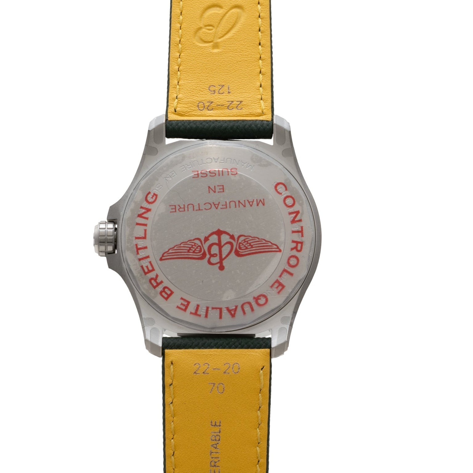 Back of a Breitling Avenger Automatic 42 watch featuring a yellow leather strap and red logo and text on the case back.
