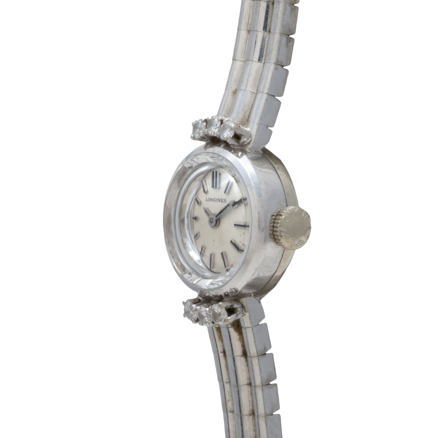 Side view of the Longines Diamond Cocktail Watch featuring a round face, diamond accents, and a silver metal band.