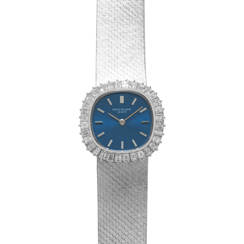 The Patek Philippe Ellipse Ladies Dress Watch features a silver mesh band, blue face, and diamond-encrusted bezel.