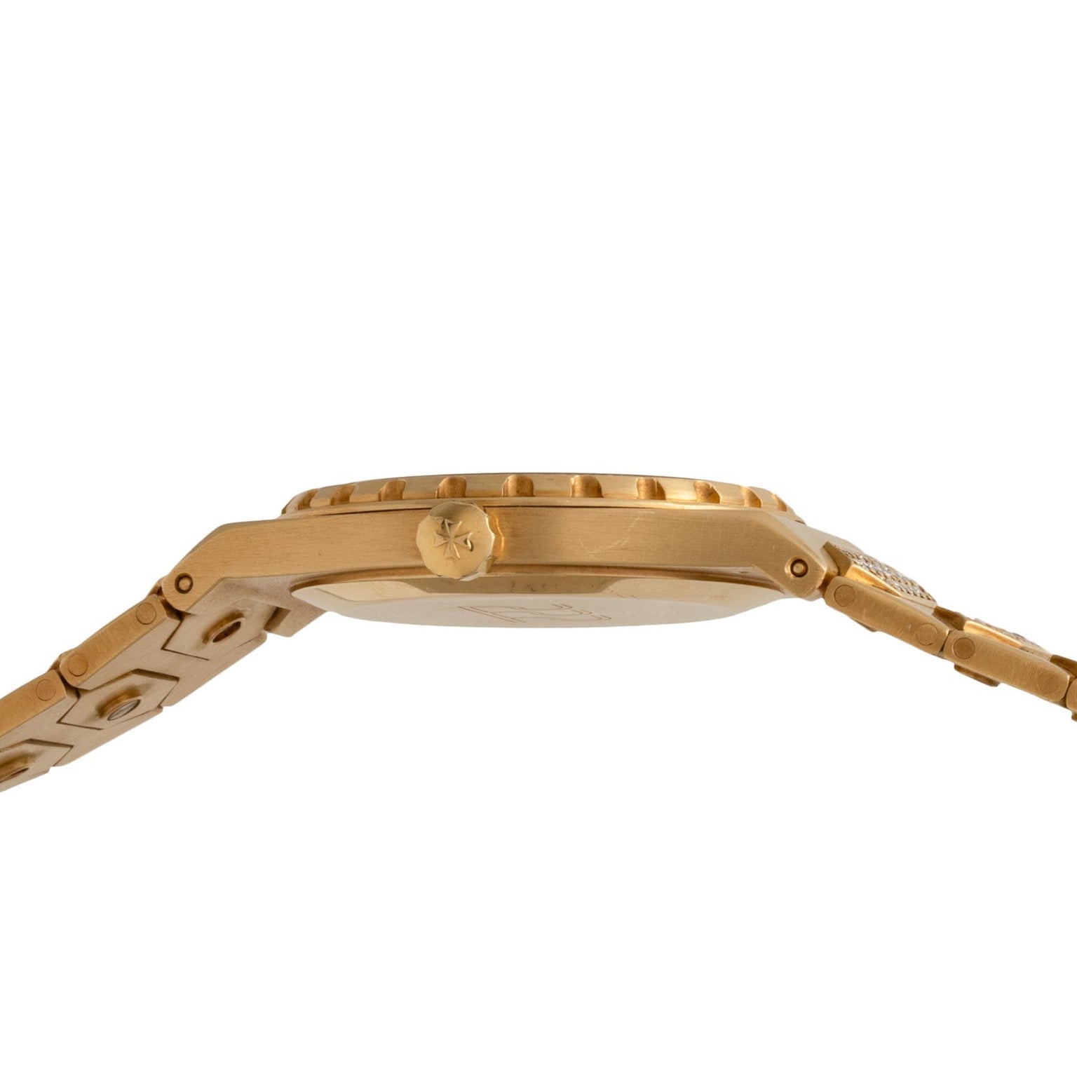 Side view of the Vacheron Constantin 222 gold wristwatch with a metal band and ridged bezel, shown against a white background.