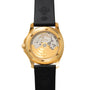 Patek Philippe Aquanaut watch with a black rubber strap features a gold case, transparent case back, and visible inner mechanism.