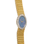Piaget Opal Yellow Gold Dress Watch features a blue opal face, diamond bezel, and woven yellow gold bracelet.