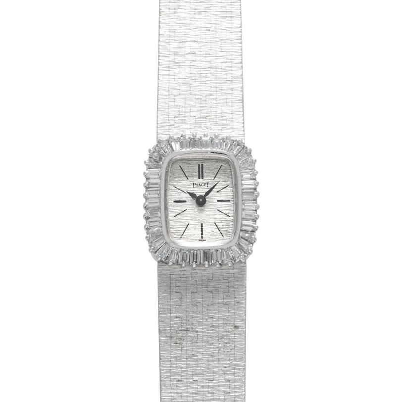 A luxurious Piaget White Gold Bark Diamond Dress Watch featuring a textured band and a diamond-encrusted rectangular face set to 10:09.