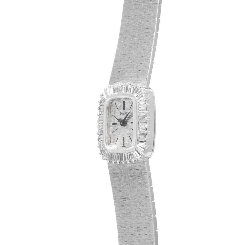 Piaget White Gold Bark Diamond Dress Watch featuring a rectangular face, textured metal band, and clear gemstone accents.