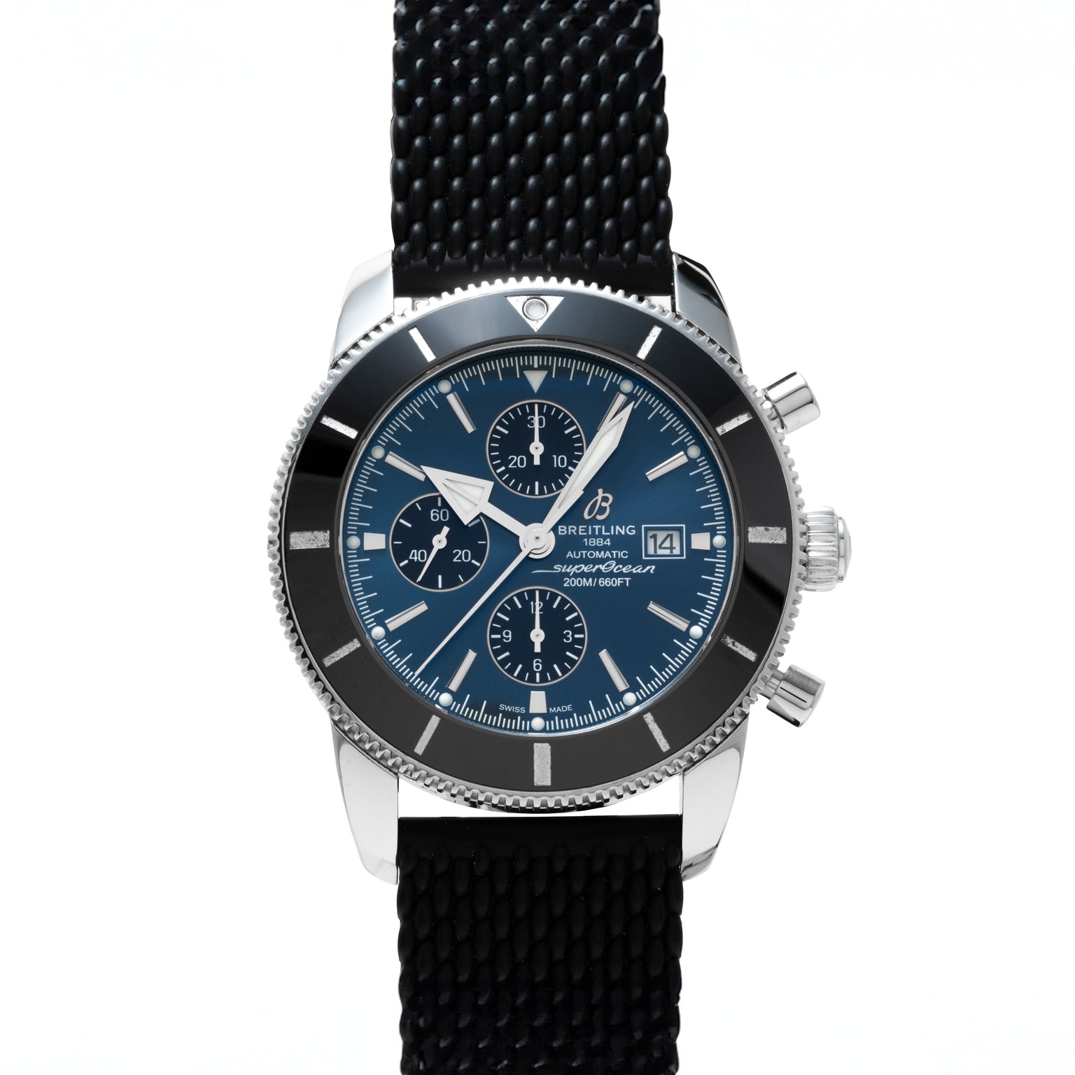 The Breitling SuperOcean B01 Chronograph 44 is a stainless steel watch featuring a blue dial and black textured strap, displayed upright.