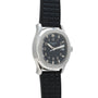 A Patek Philippe Aquanaut wristwatch with a black rubber strap and black dial, displayed at an angle.