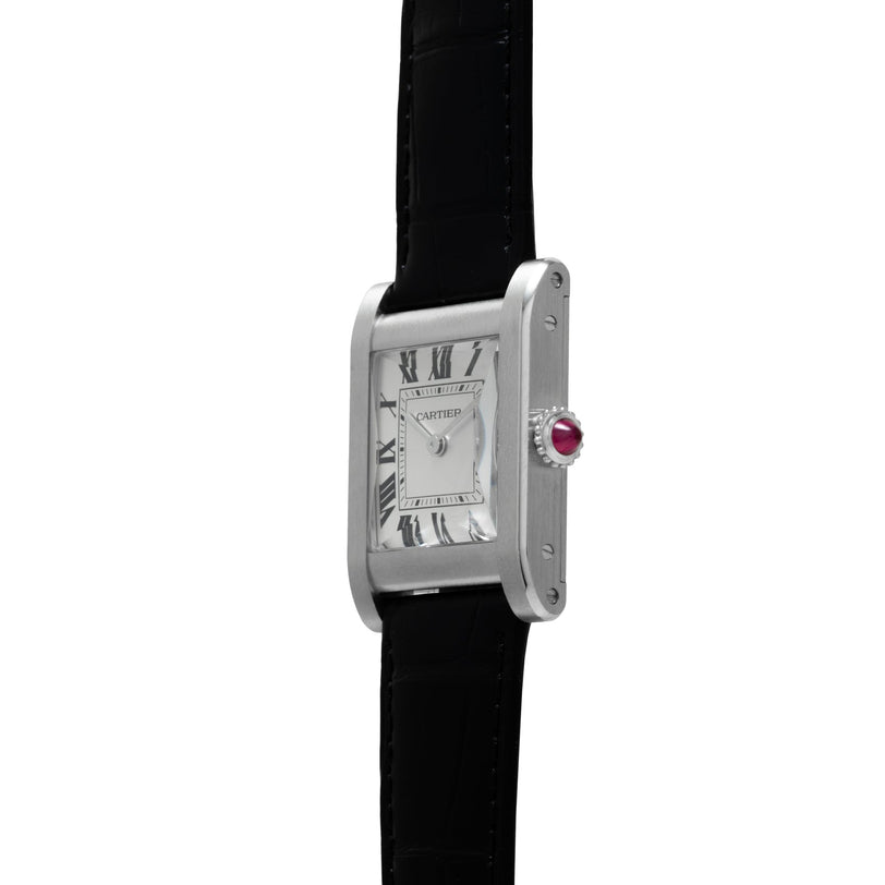 A side view of the Cartier Tank Normale, a silver watch with a black leather strap and Roman numeral dial.