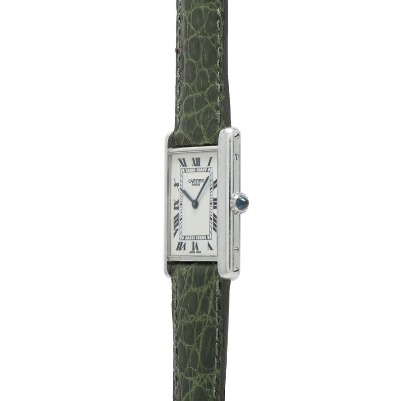 The Cartier Tank Louis CPCP is a rectangular watch featuring a green leather strap and Roman numerals on its white dial.
