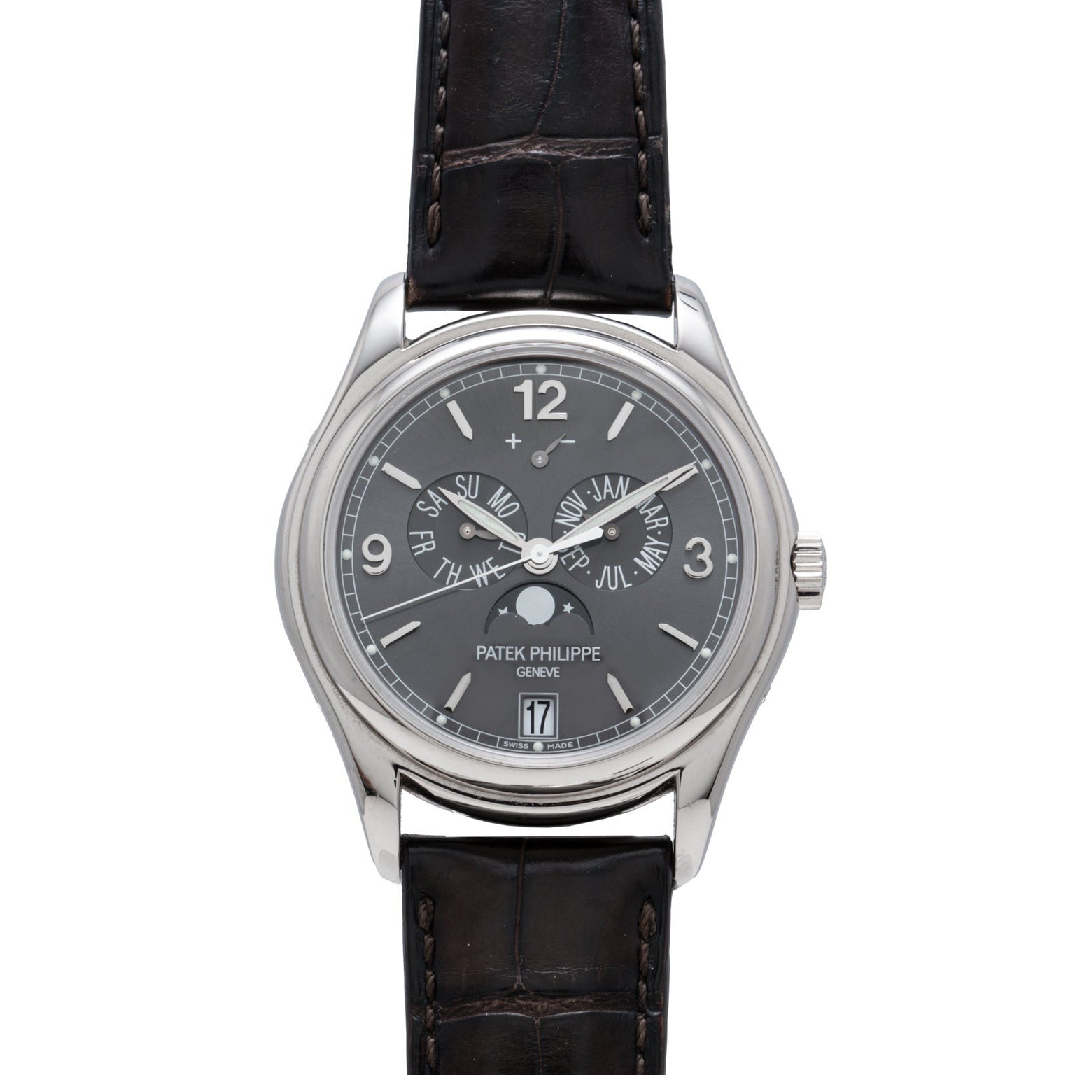 The Patek Philippe Annual Calendar is a luxury wristwatch featuring a black leather strap and a dark gray dial with multiple functions.