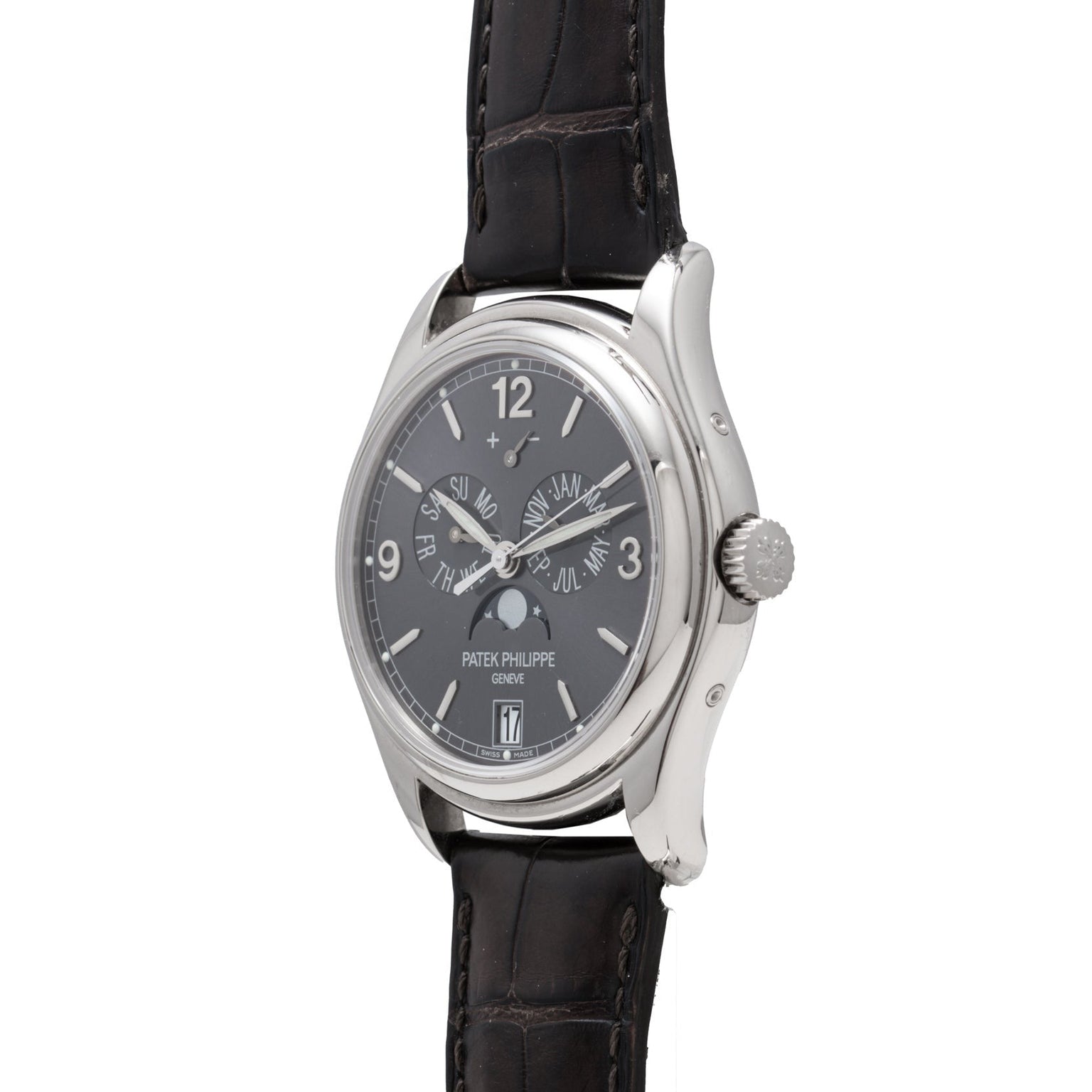 A Patek Philippe Annual Calendar wristwatch in silver with a black leather strap and black dial featuring multiple subdials.