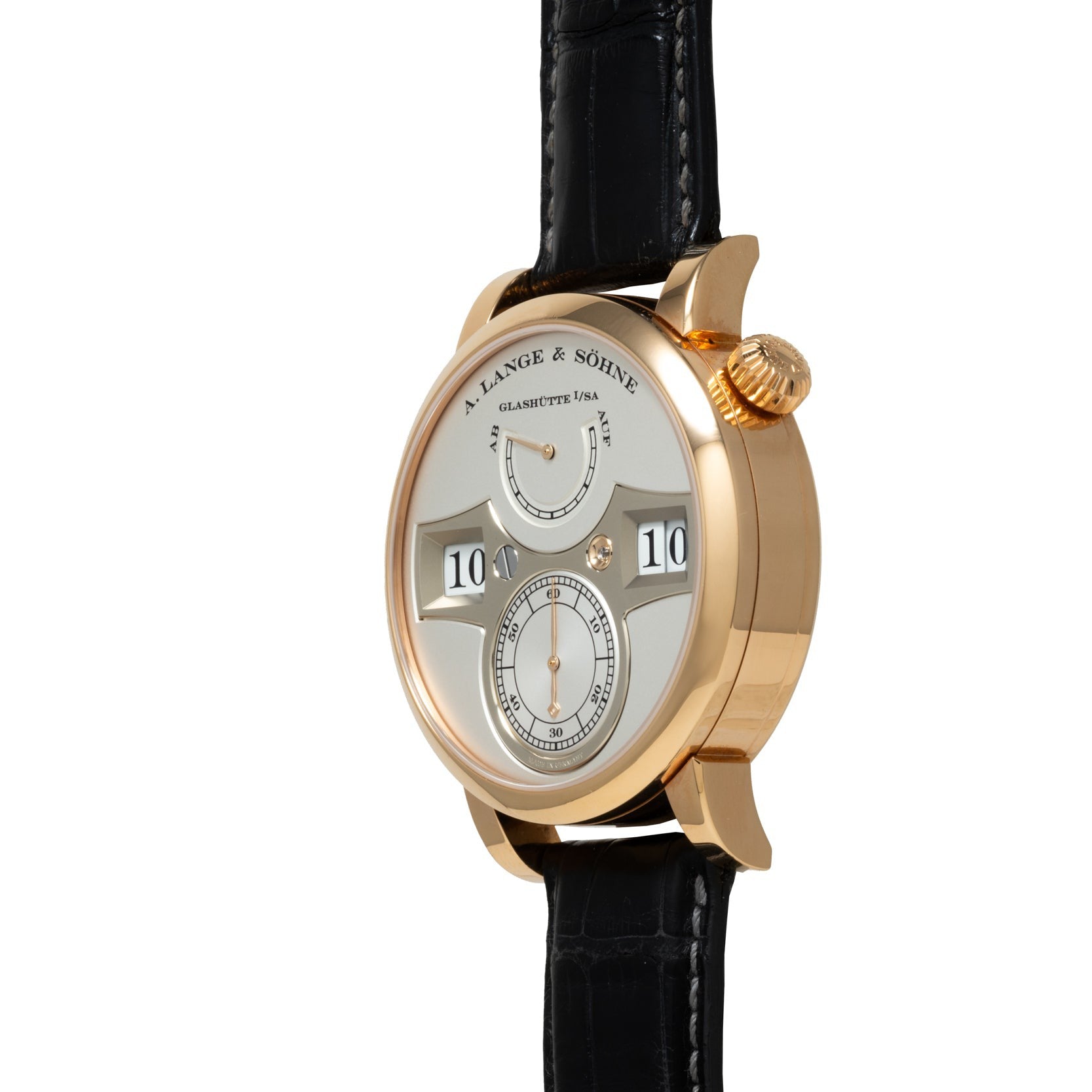 Side view of a Lange & Sohne Zeitwerk gold wristwatch featuring a black leather strap and digital time display.
