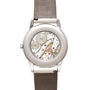 The Patek Philippe Calatrava features a transparent case back that reveals the intricate mechanical movement inside.